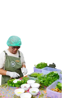 Staff sorting fresh vegetables into bowls